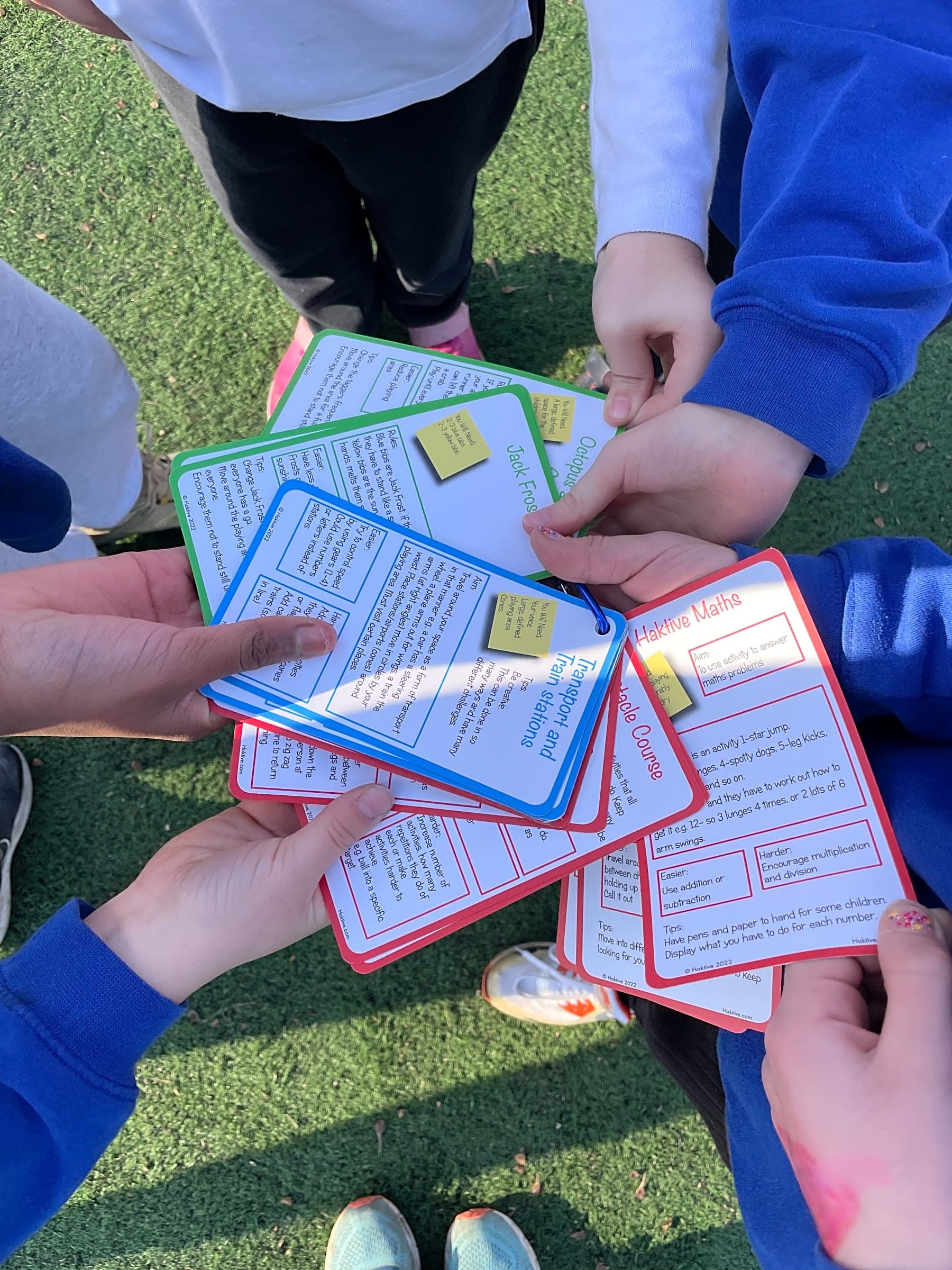 Children using Haktive Cards on a school playground